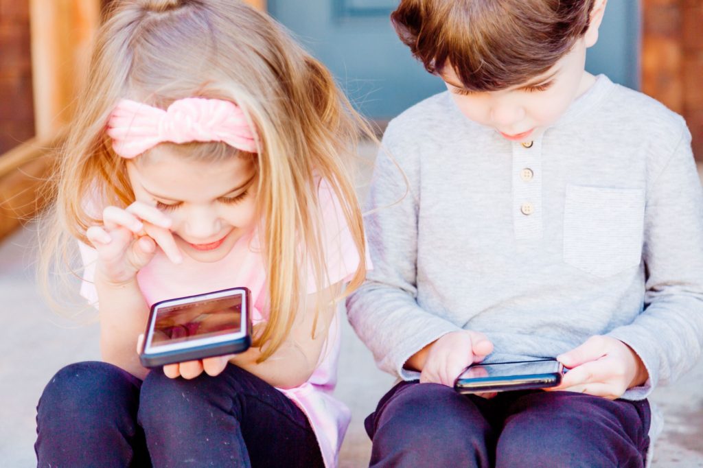 Children on cell phones; similar to how children repeat words.