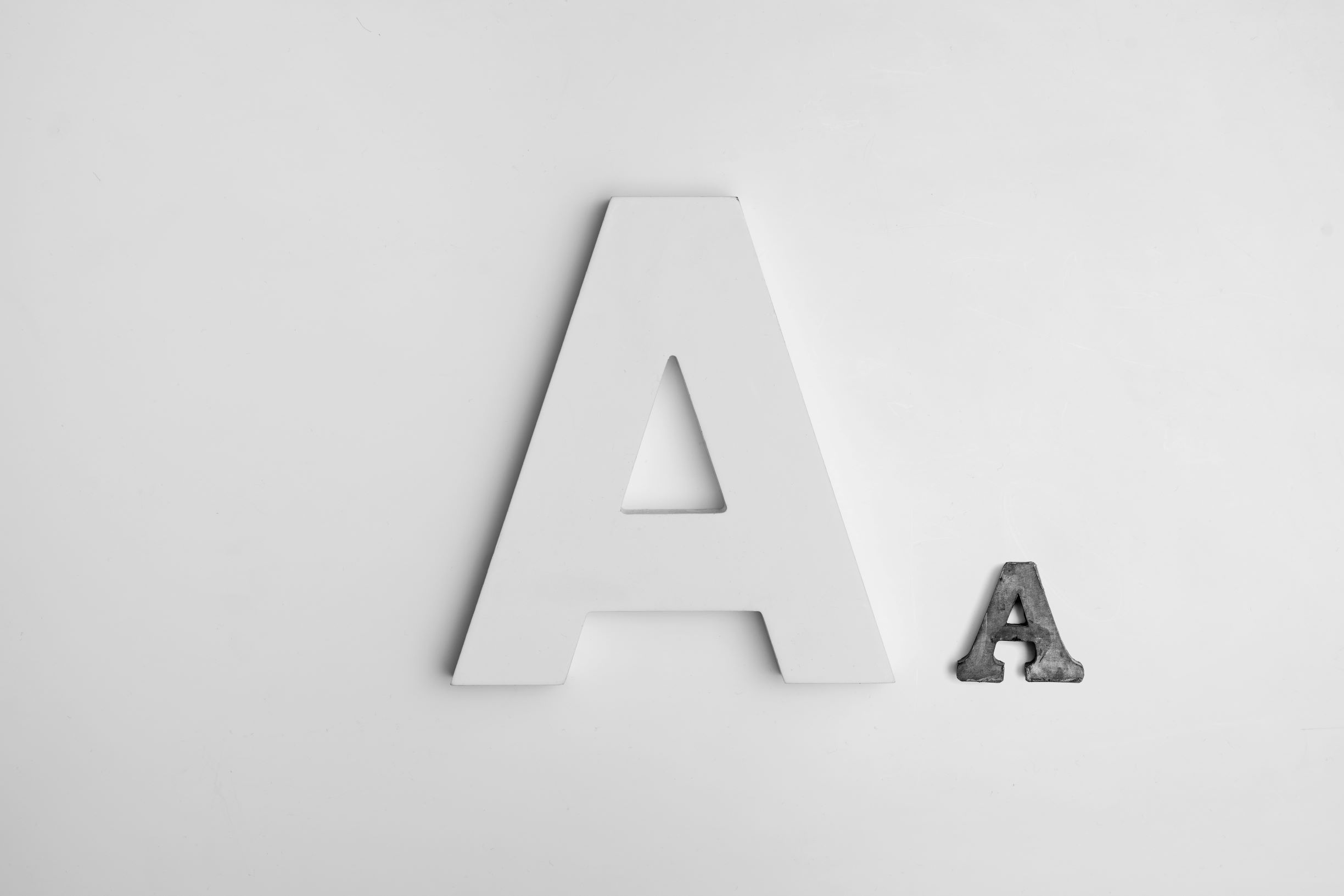 Capital and small letter "A". Connects to letter/sound identification, aka phonemic awareness.